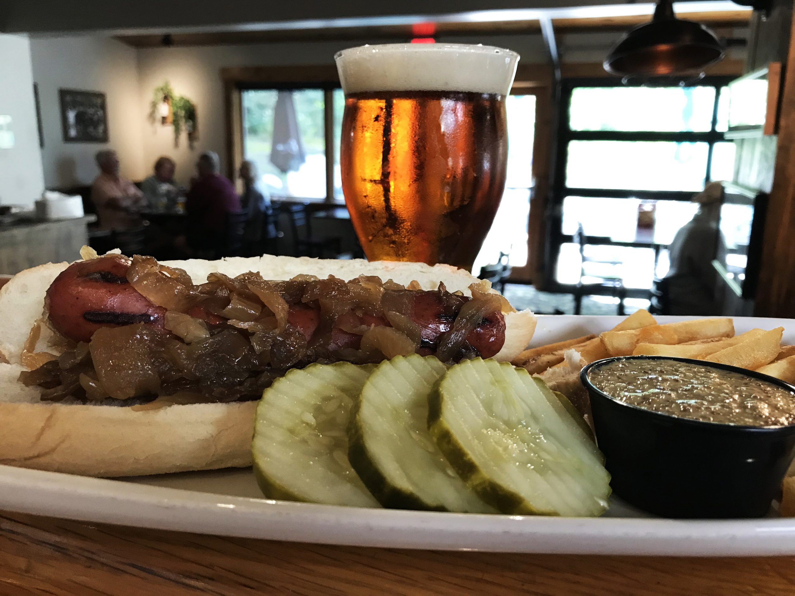 Dam Brewery Zuma Zen Oktoberfest beer with a bison, jalapeño, cheddar sausage and fries